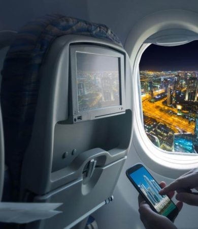 woman on phone in plane - Wireless IFE